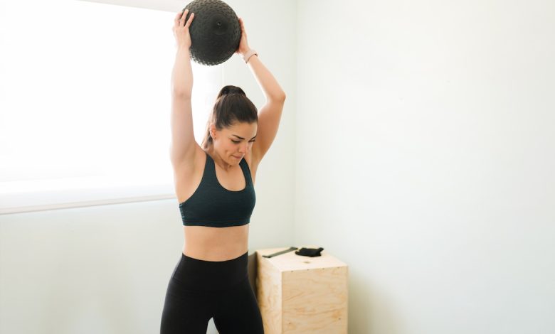 6 Slam Ball Exercises to Do for Explosive Power, Full-Body Strength, and Serious Stress Relief