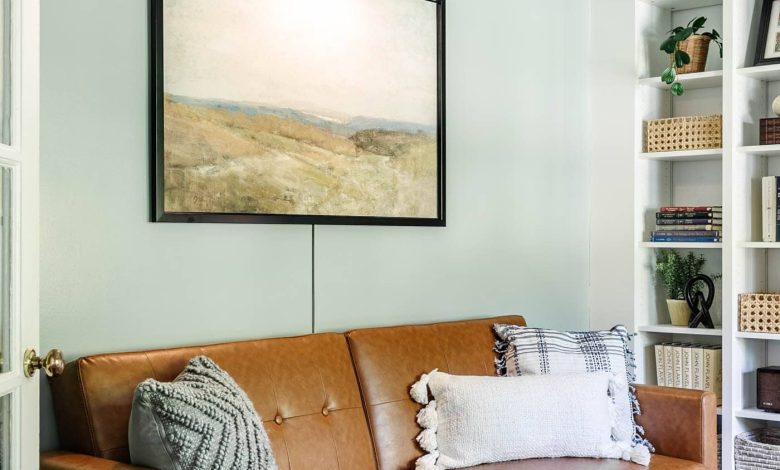 home office lounge area with faux leather futon