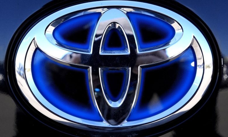 Scandal-hit car maker Toyota sees profits take a tumble