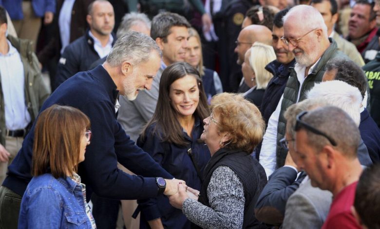 Spain's royals return to flood-hit region weeks after being pelted with mud