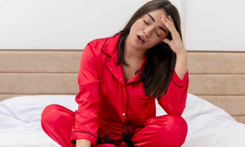 A tired woman on the bed