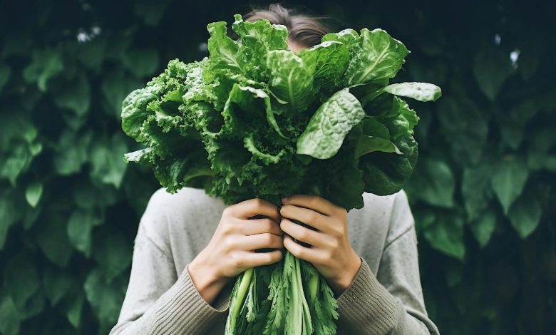 woman holding spinach