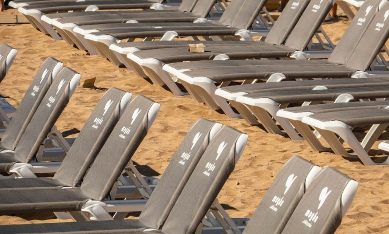 ‘Not for sale’: Anti-tourism protestors destroy hundreds of sunbeds in Tenerife