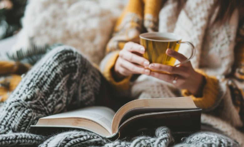 Woman drinking tea in bed.