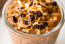 One glass jar filled with samoas overnight oats. It