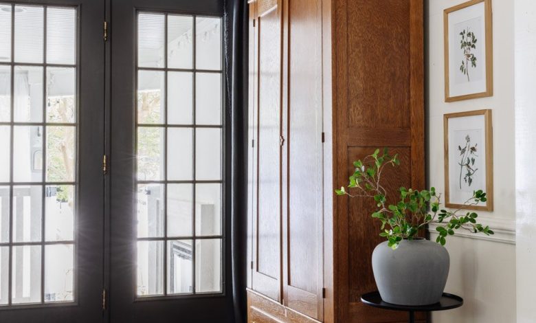 armoire coat closet in an entryway for storage without a mudroom