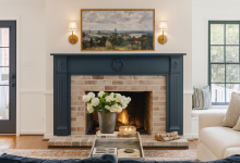 AI living room mockup using ChatGPT to create a creamy white living room with black doors and navy blue fireplace mantel
